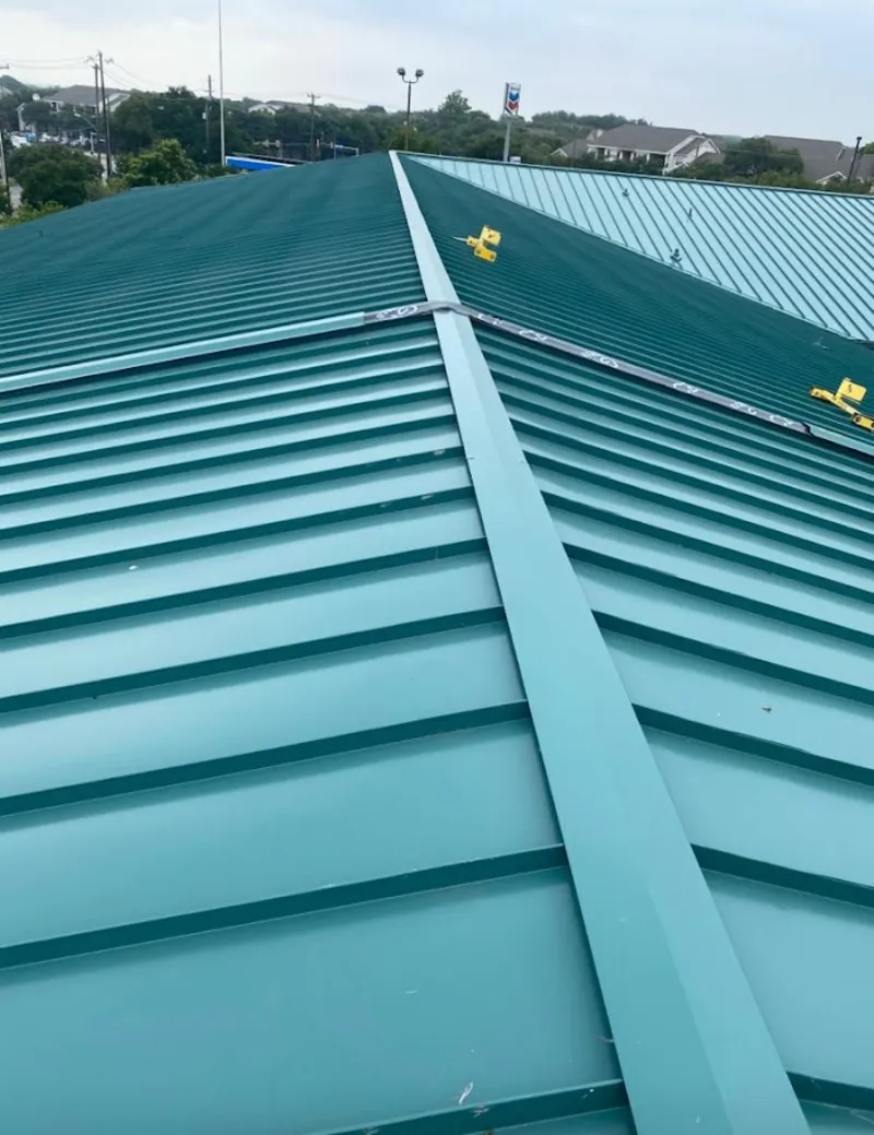 Green commercial metal roof ridge and valley for Metal Roof Repair in East Manchester